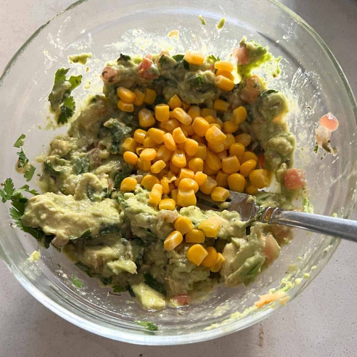Corn mixed with avocados and guacamole. 