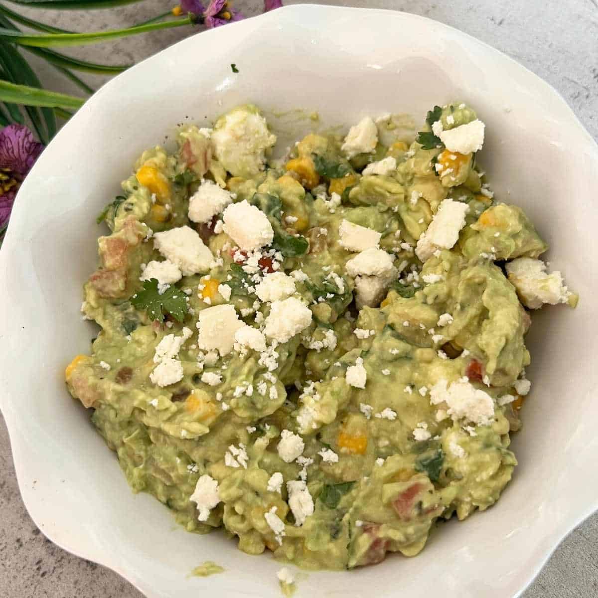 Finished  Sweet Corn Guacamole topped with Cotija cheese. 