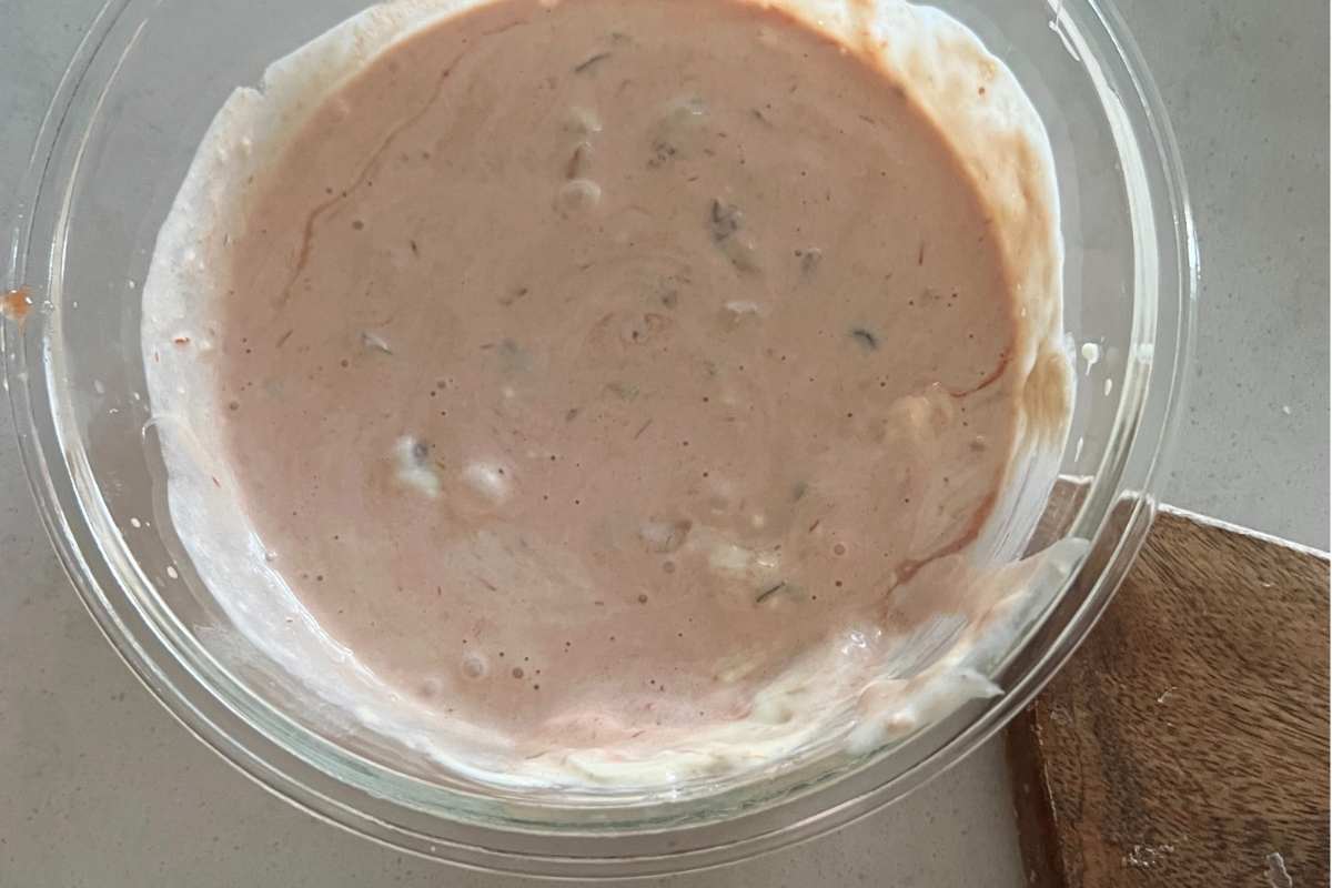 Dressing ingredients for macaroni salad mixed in a bowl.