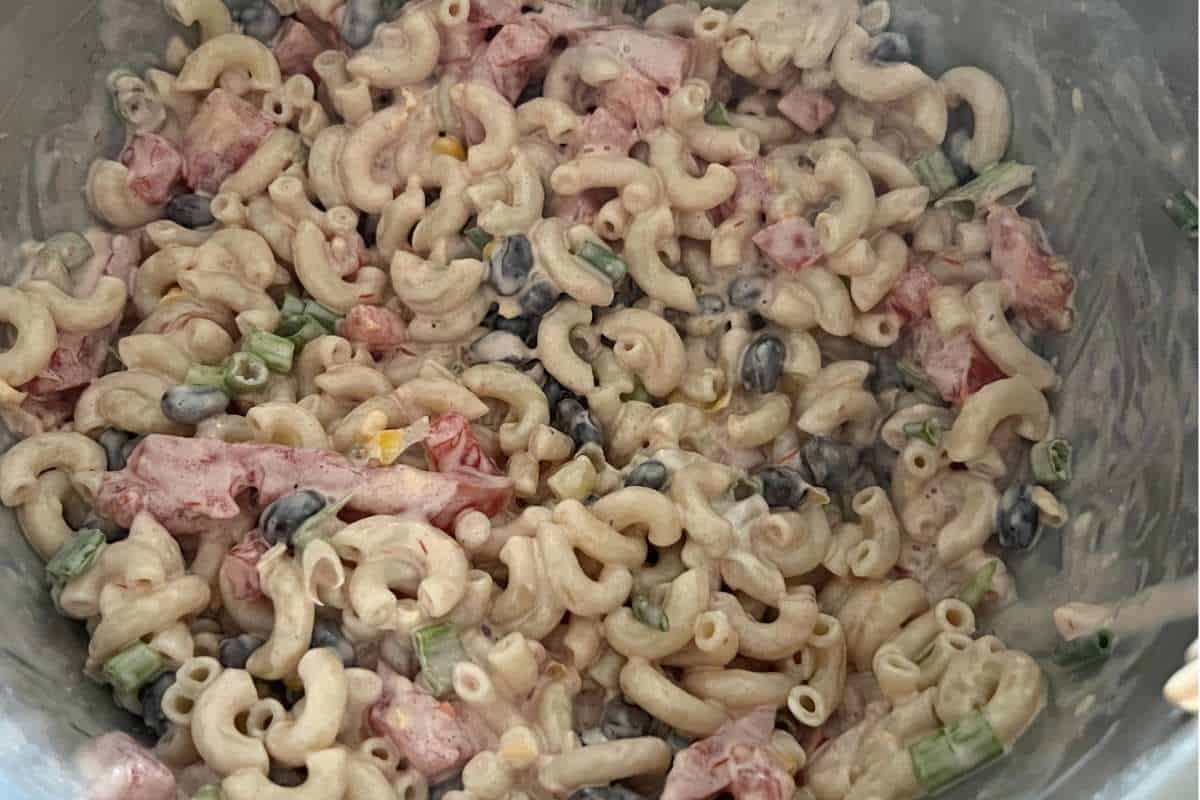 Salad ingredients all mixed together in a bowl for Mexican Macaroni Salad.