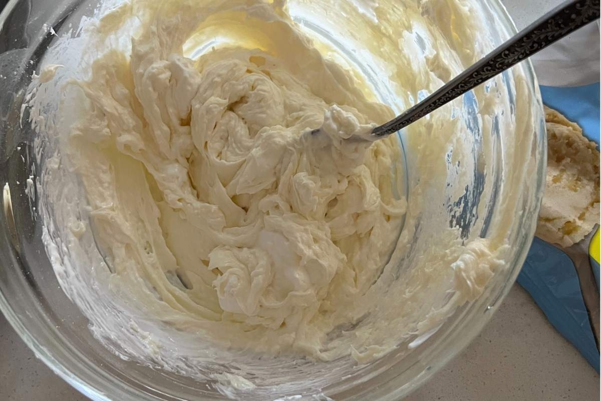Cream cheese mixture in a clear bowl.