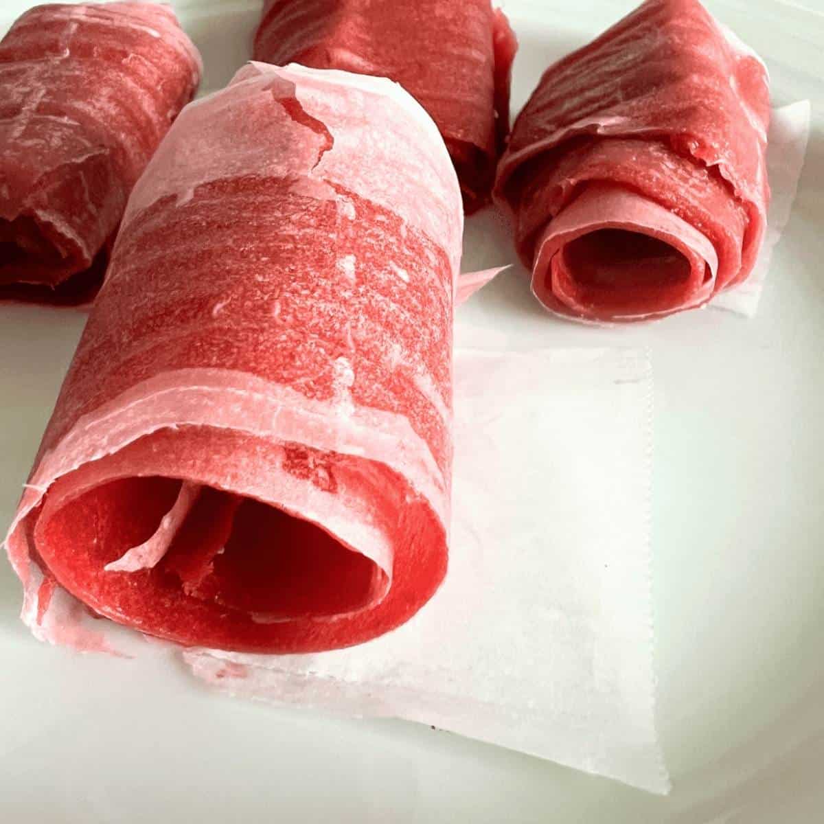 Rhubarb fruit leather on white back ground.