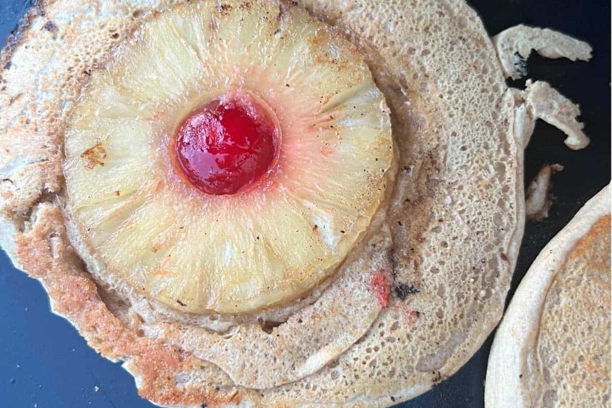 Finished pineapple upside down pancakes on a Blackstone.