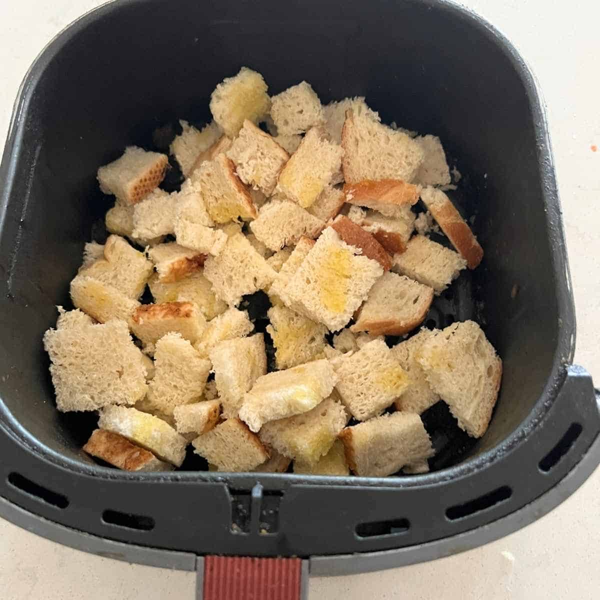 Coated bread crumbs with olive oil in air fryer. 