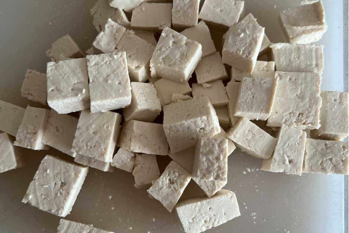Cut up cubed pieces of tofu ready for air fryer.
