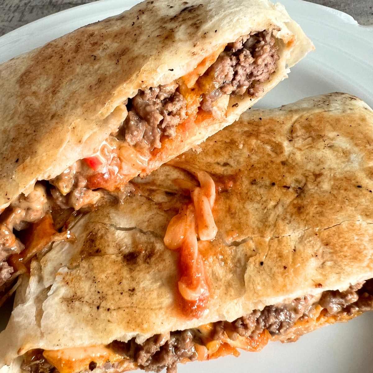 Blackstone crunchwraps on a white plate.