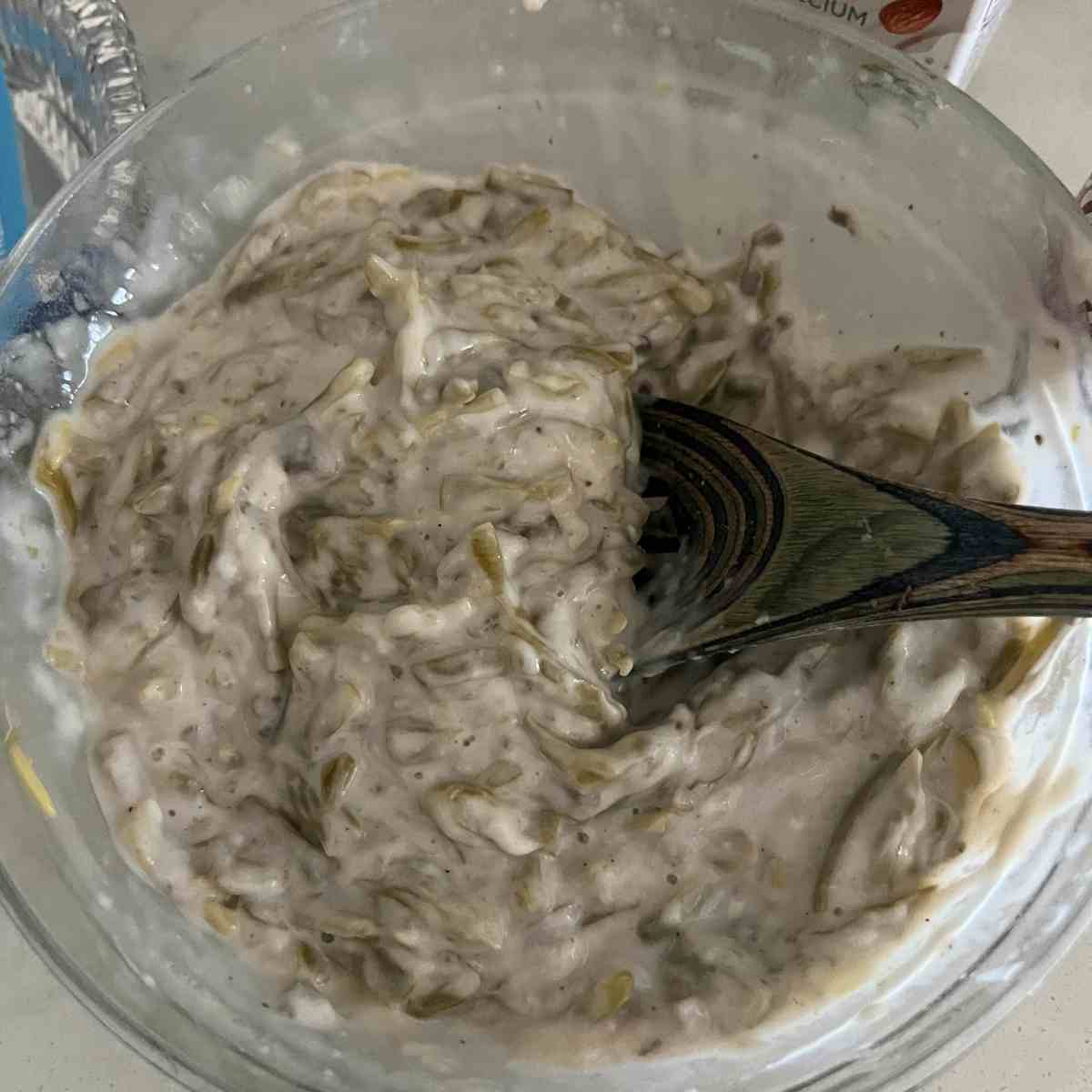 Green bean casserole mixed in a bowl. 