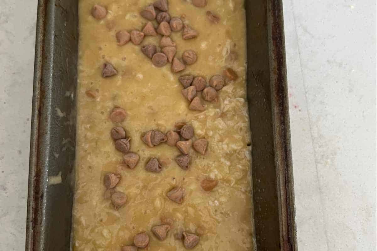 Banana bread mixture in a loaf pan. 
