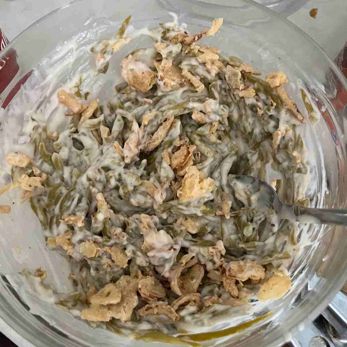 Green bean casserole mixed in a bowl.