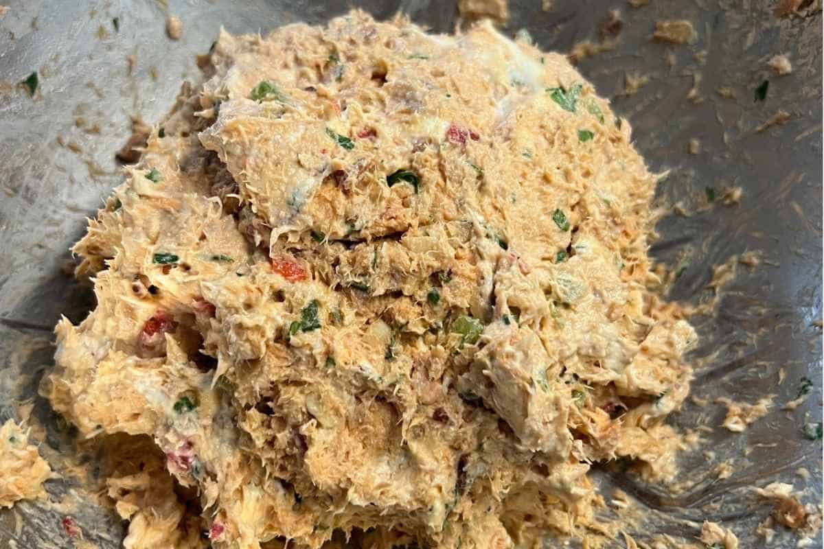 Cream cheese mixture for almond ball recipe in a bowl.