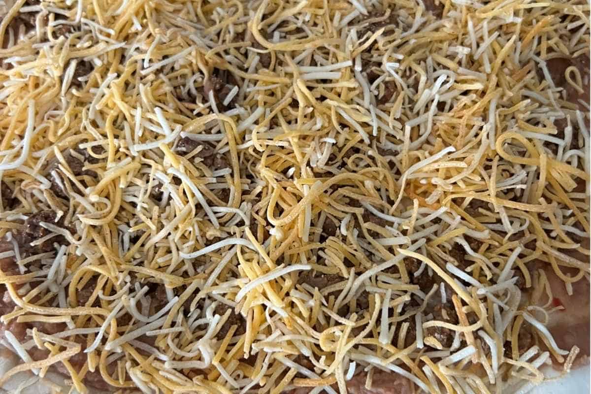 Ground beef and cheese topped on taco pizza. 