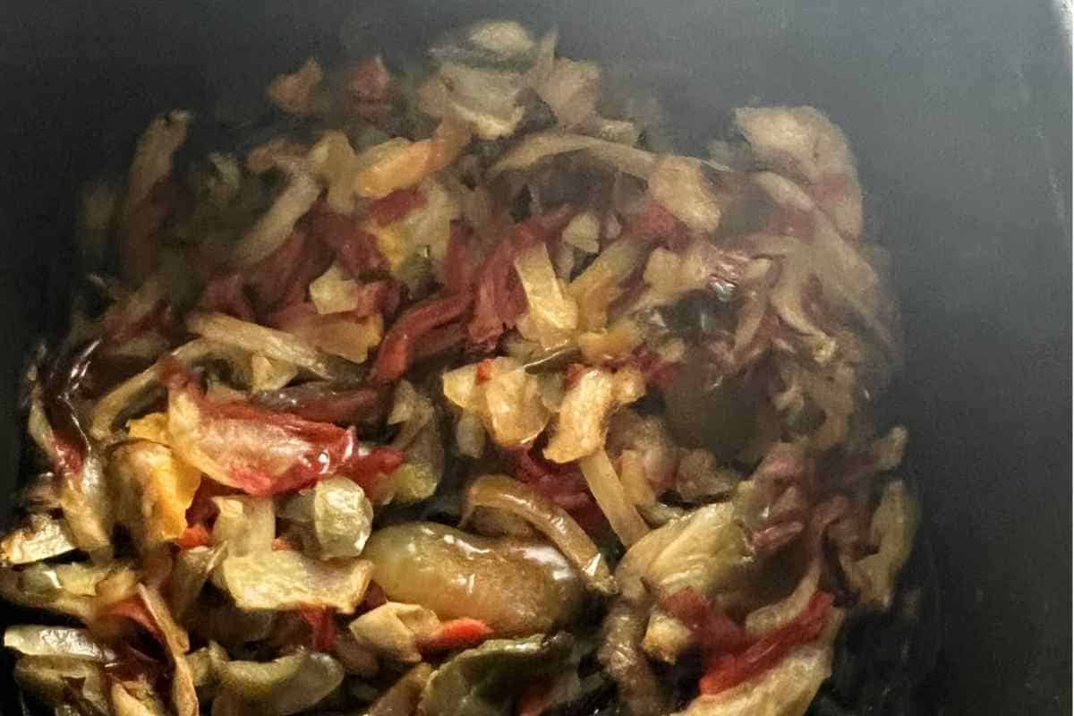 Air fried pepper and onions in a basket. 