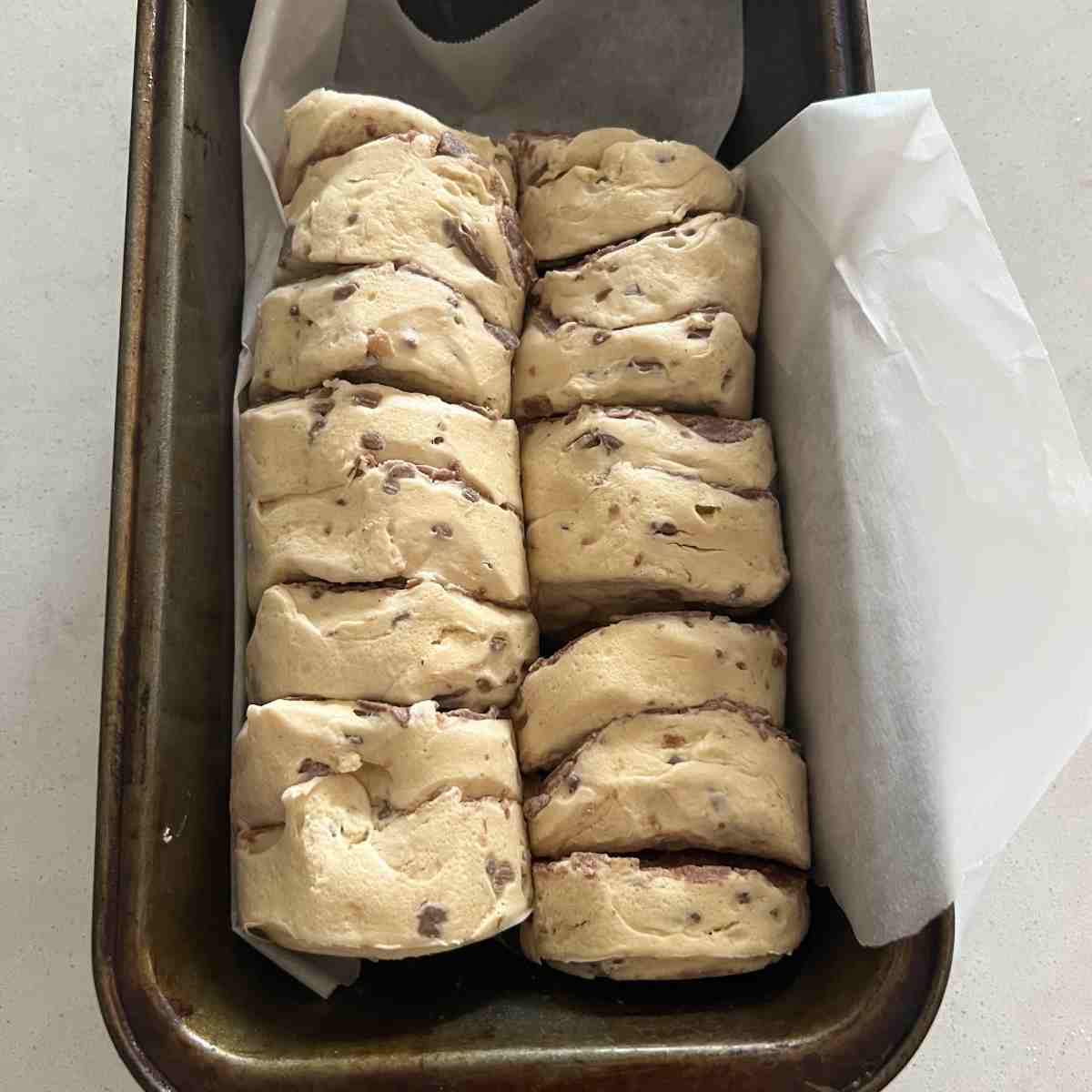 2 cans of cinnamon rolls next to each other.