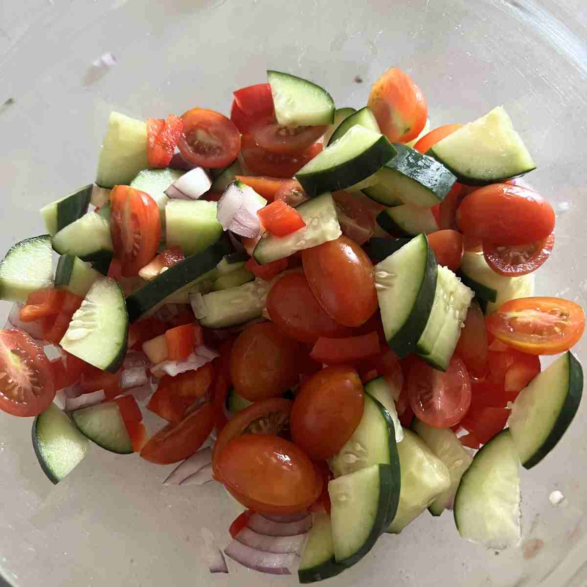 Chopped veggies for dense bean salad.