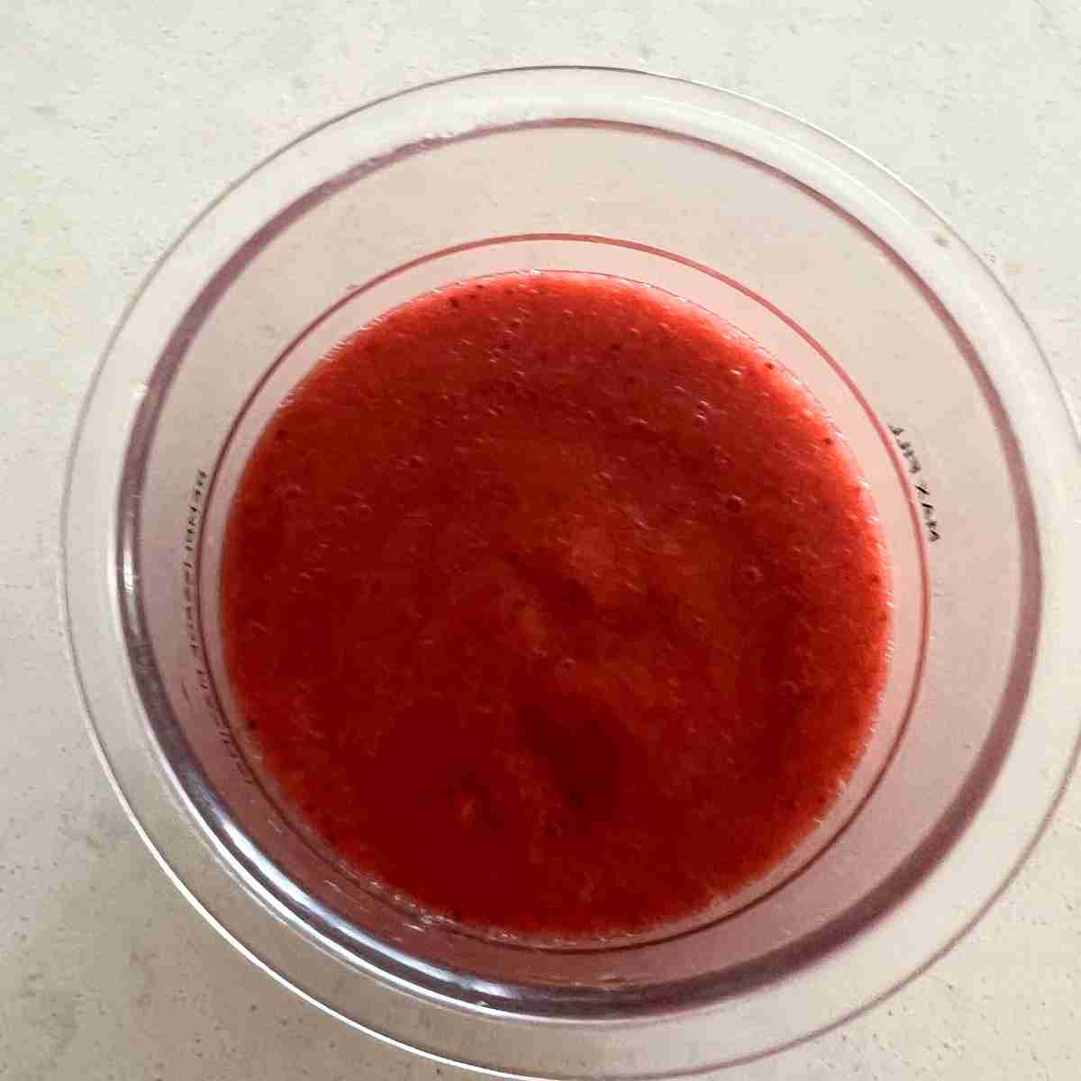 Blended strawberry sorbet in Ninja Creami Pint. 