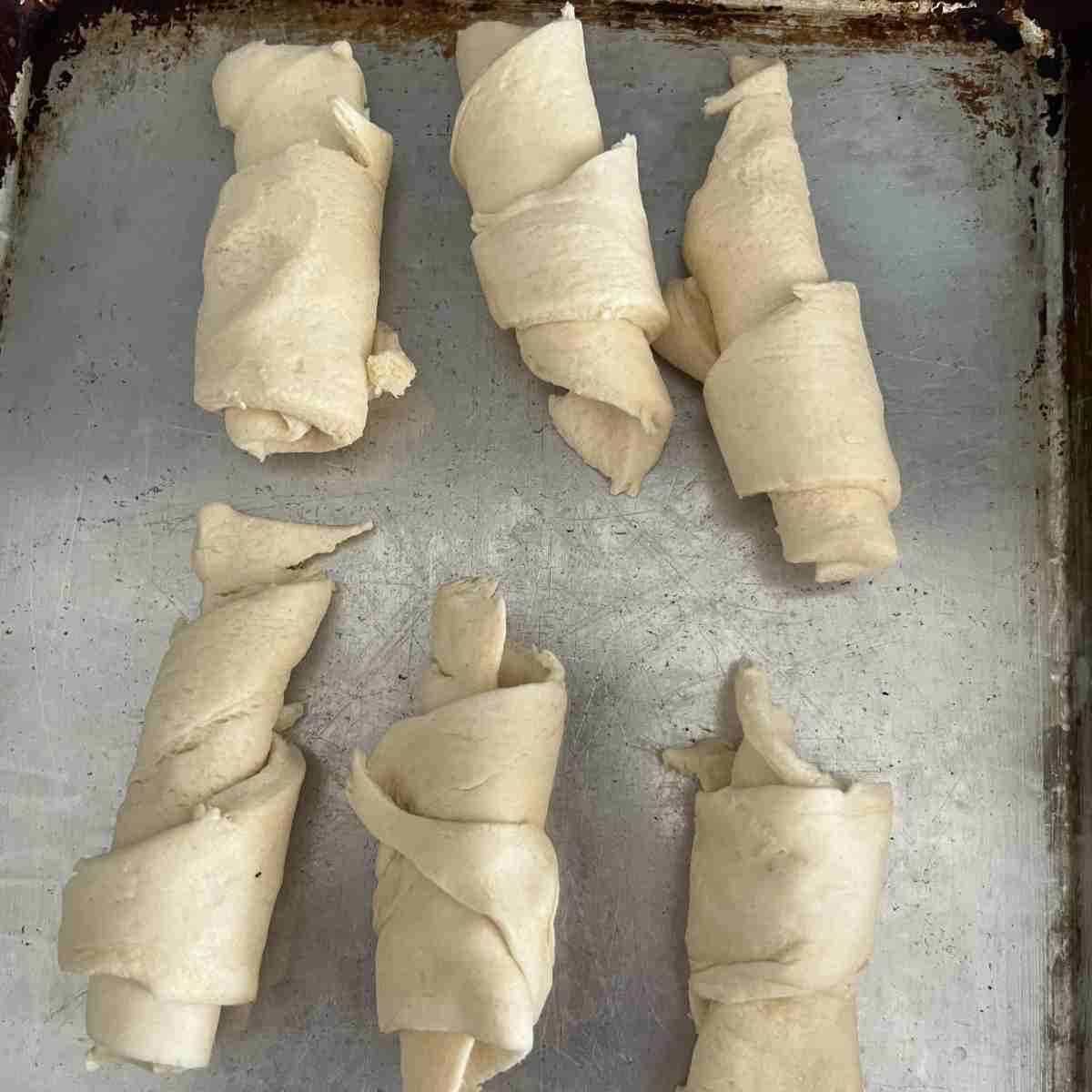 Rolled out and shaped crescent rolls. 