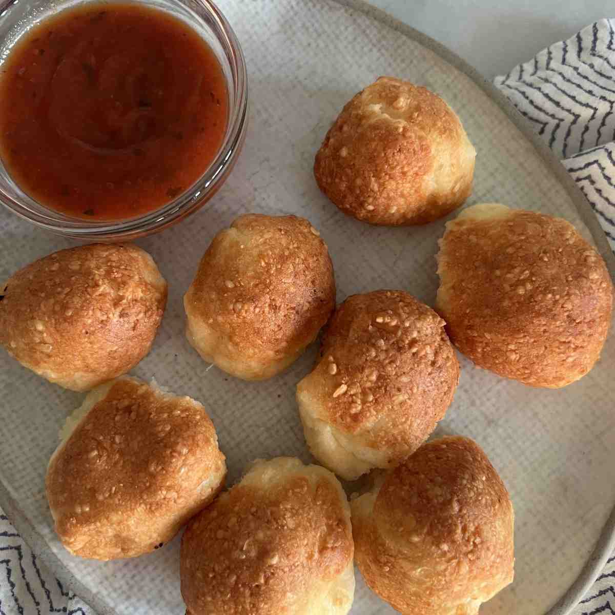 Viral air fryer parmesan cheese balls with marinara sauce.