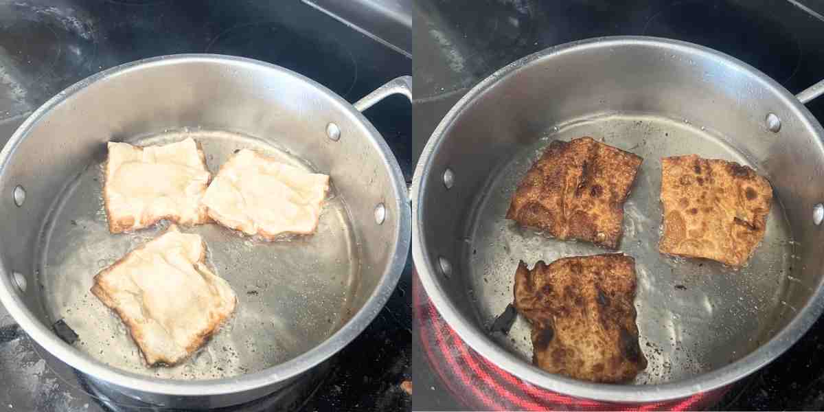 Crab rangoon nachos deep frying in a pan.
