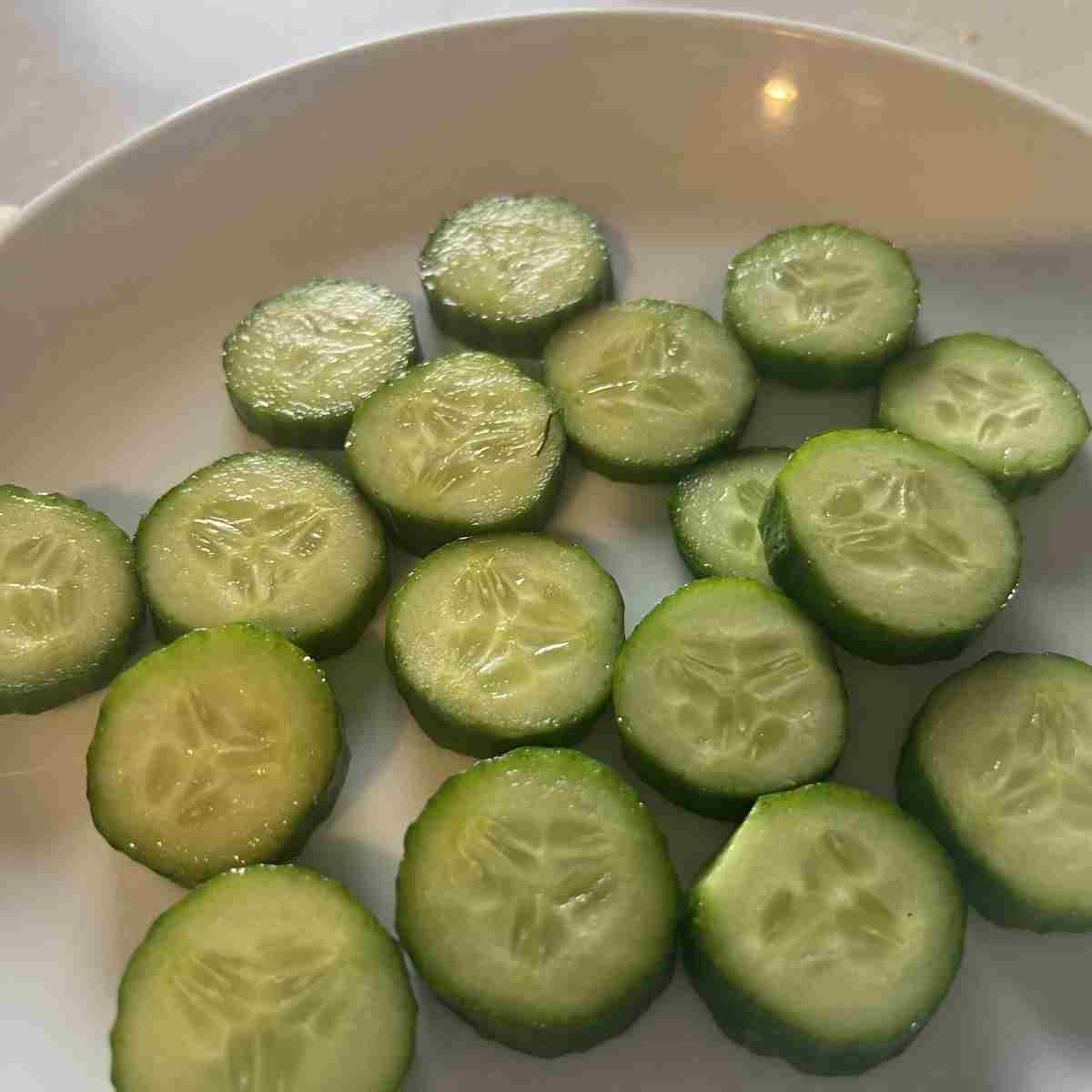 Sliced cucumbers on a plate.