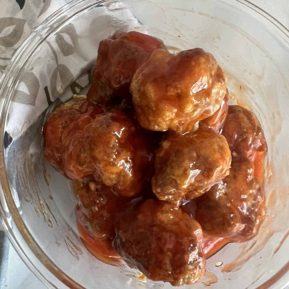 Smoked meatballs with sweet and sour sauce.