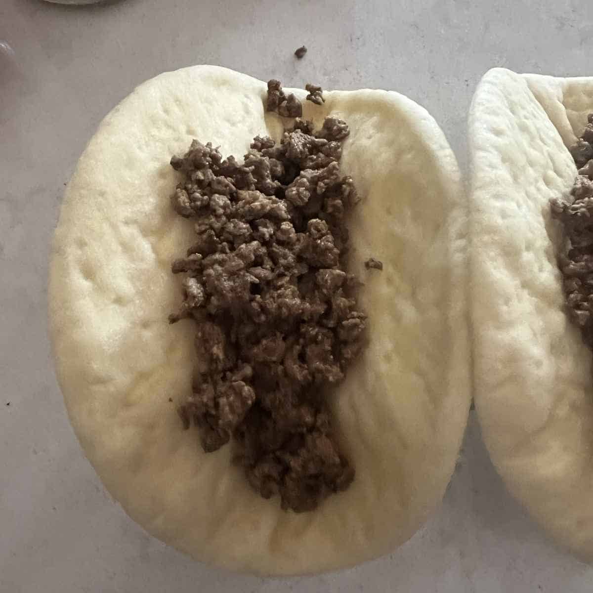 Ground beef on chalupa shell. 