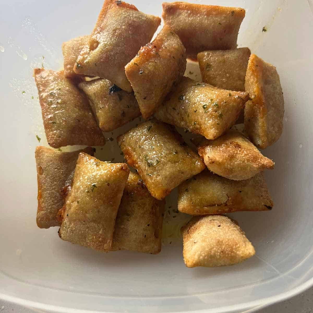 Air fryer pizza rolls tossed in butter and garlic powder. 