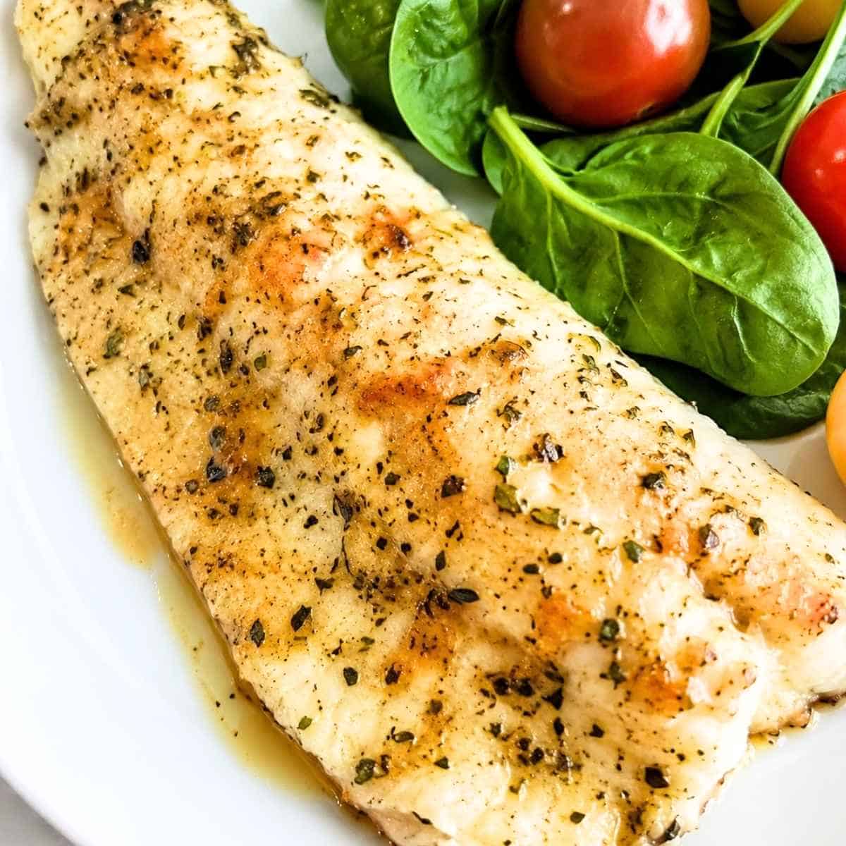Baked walleye with herbs and butter.