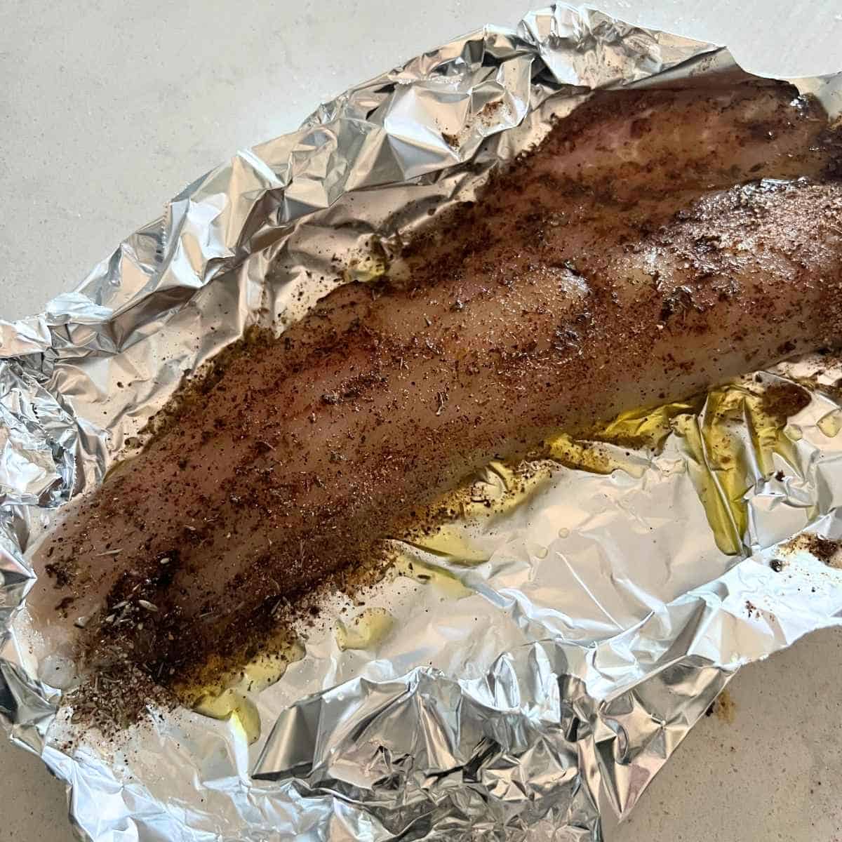 Seasoned fish in foil.