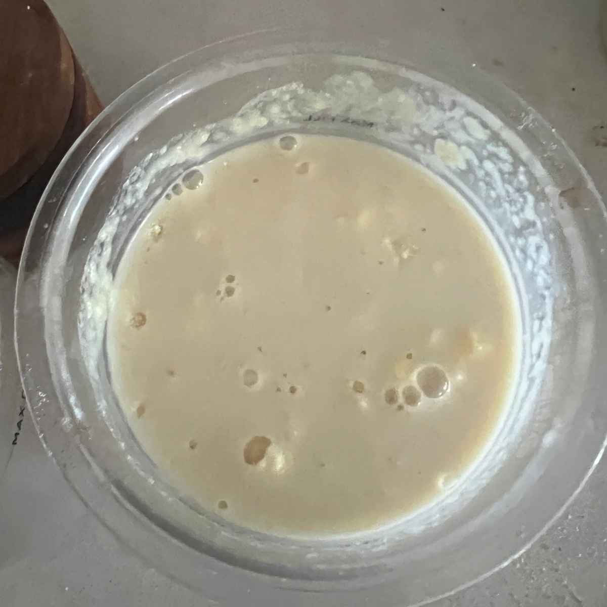 Blended Ninja Creami ingredients in pint container.