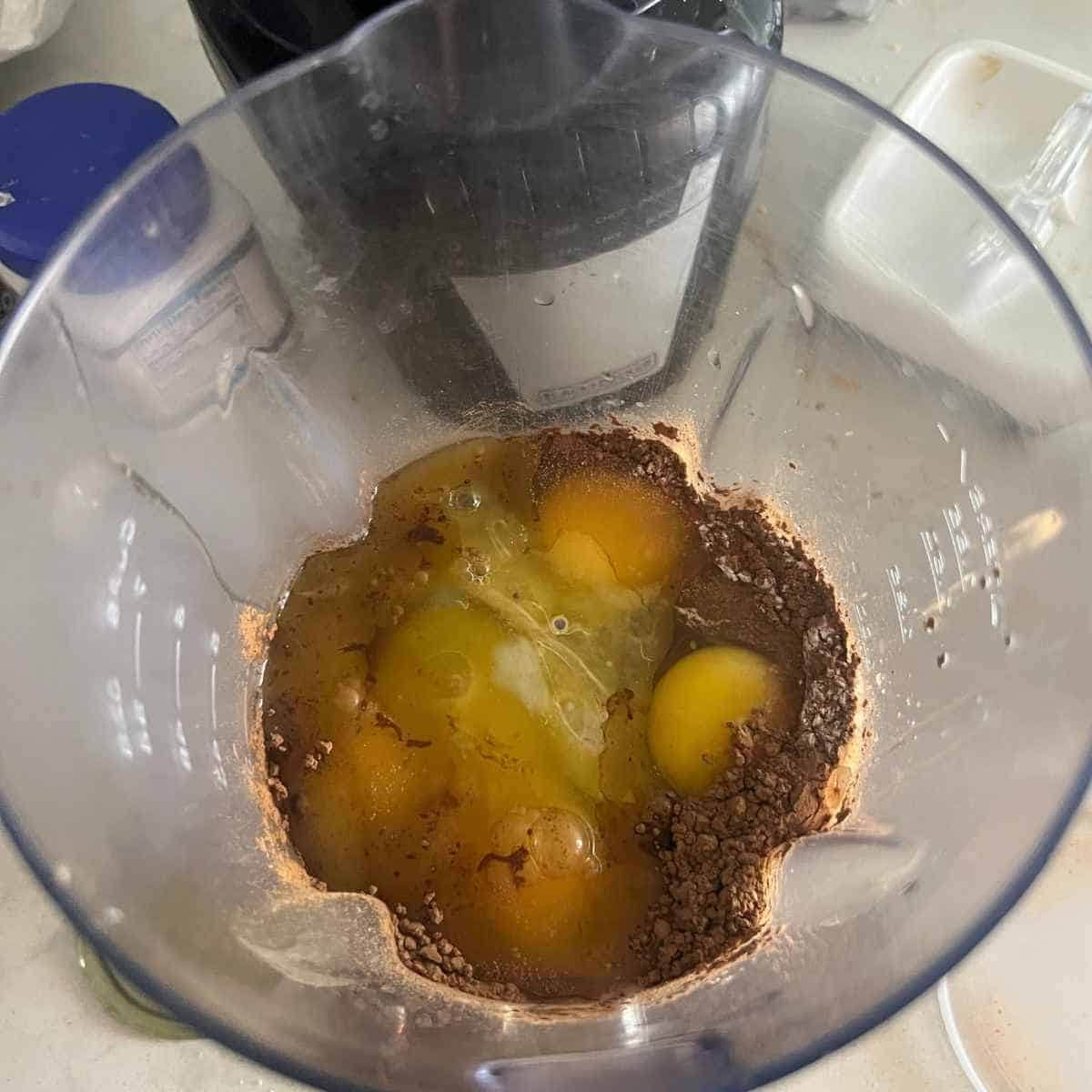 Chocolate cake ingredients in a blender.