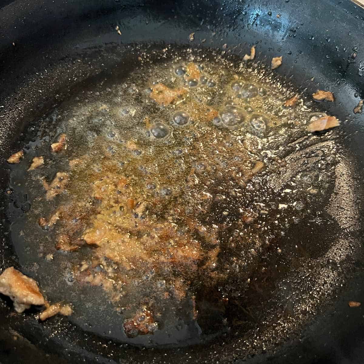 Butter searing in a skillet. 